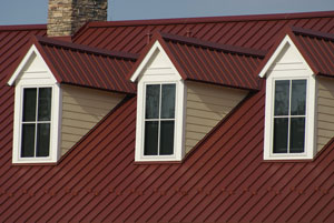 Home with reddish-brown standing seam metal roofing
