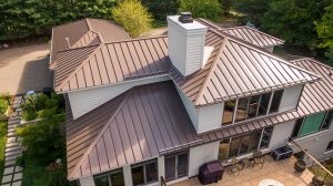 Top down view of a home with a brown metal roof