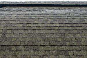 Close up view of grey asphalt shingle roofing
