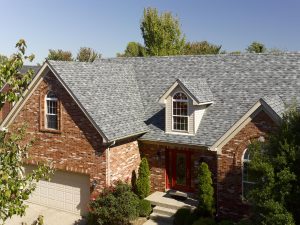 A beautiful residential home with a shingle roofing system